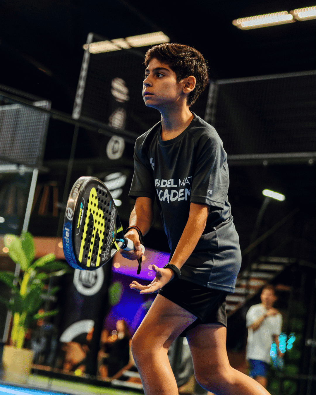 Young Padel Mate Academy player practising on court