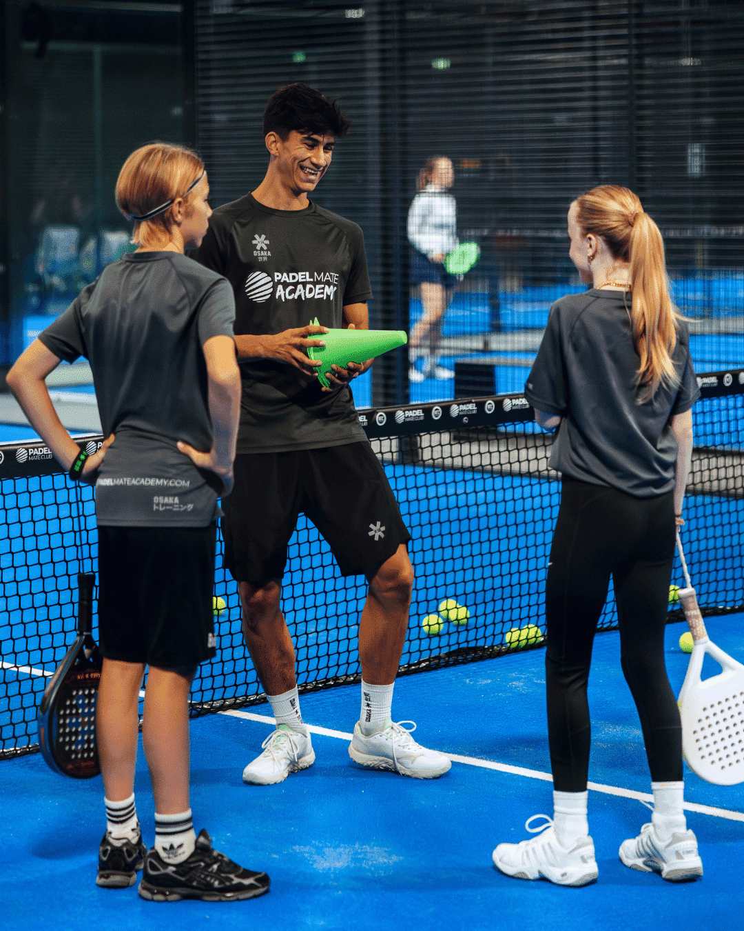 Padel Mate Academy coach training two young padel players